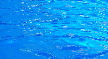beautiful clear pool water reflecting in the sun background