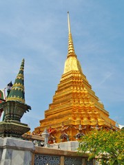 Fototapeta premium Golden pagoda in Temple of Emerald Buddha (Wat Phra Kaew) at Grand Palace in Bangkok Thailand.