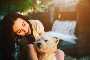 girl playing with a dog