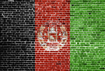 Flag of Afghanistan painted on brick wall, background texture