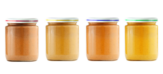 Jars of baby puree isolated on white