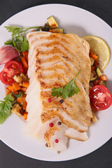 grilled fish fillet and vegetables