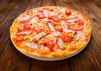 Delicious pizza with red and green hot chili peppers