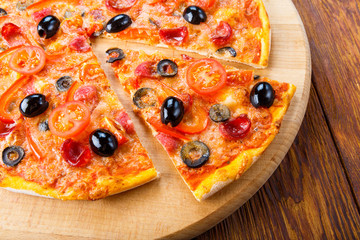 Delicious pizza with salami, mushrooms and olives