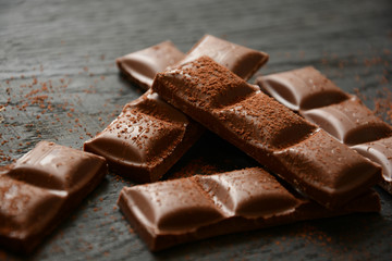 Milk chocolate on dark background