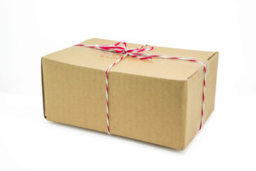 Parcel cardboard box and tied with string