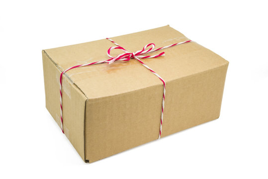 Parcel cardboard box and tied with string