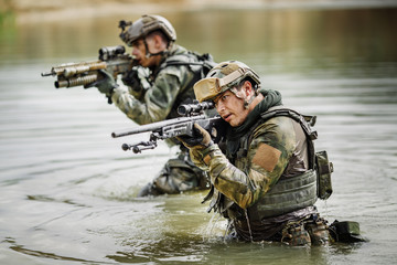 Portrait of a ranger in the battlefield with a gun