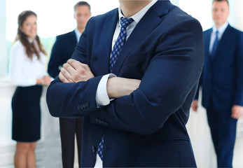 Businessman with colleagues in the background