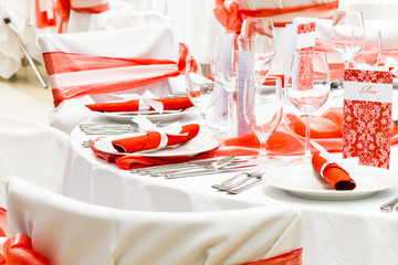 wedding tables set for fine dining or another catered event, red decoration