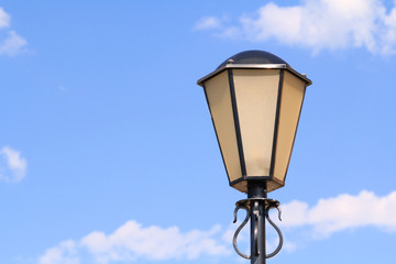 Fototapeta na wymiar Decorative Street lamp on the background of the blue sky