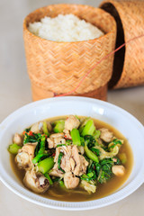 Kang Om or Curry chicken.A savoury thick soup made from spices and vegetables with chicken and sticky rice.Thai cuisine