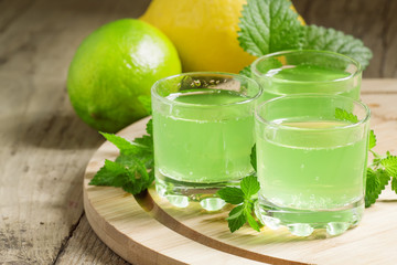 Citrus juice with soda in a glass on a wooden background, select