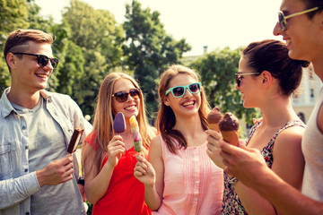 group of smiling friends with ice cream outdoors