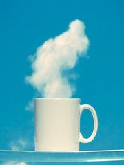 Coffee cup against the sky