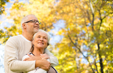 happy senior couple in autumn park