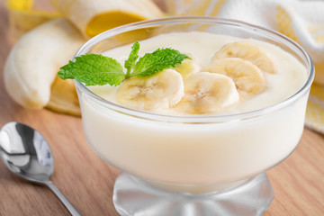 Yogurt with banana in glass
