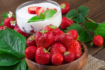 Strawberries yogurt dessert in a glass with fresh fruits