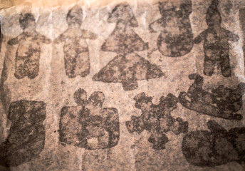gingerbread on baking sheet. stains from Christmas cookies on a baking paper