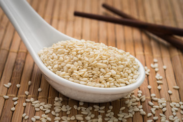 Sesame seeds on spoon