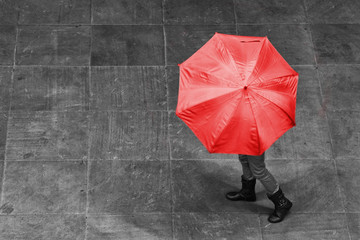 Girl walk with umbrella in rain on pavement artistic conversion