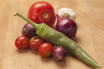 Organic vegetables on wooden background
