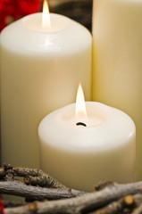White candles in autumn winter decoration