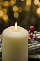 White candles in autumn winter decoration