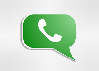 Green phone handset in speech bubble icon