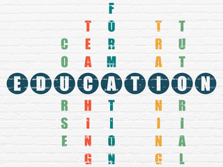 Education concept: word Education in solving Crossword Puzzle