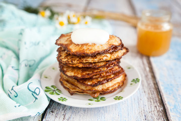 Healthy breakfast with oatmeal pancakes and honey