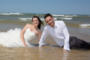 Beautiful couple at the beach happy together