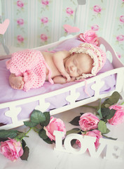 Fototapeta na wymiar Newborn baby girl asleep