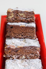 several chocolate cakes lies on a plate