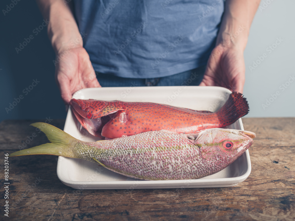 Wall mural Tray with two exotic fish