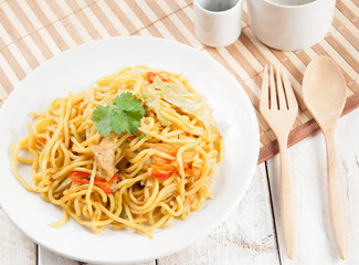 noodles and vegetables on wood