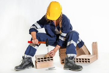Young woman nail and hammer