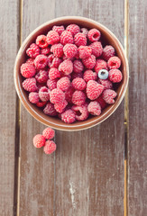 Fresh raspberries on a wooden table
