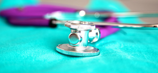 Stethoscope on a background of medical coat