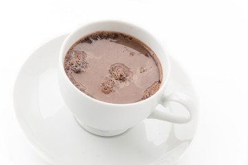 a cup of chocolate on white