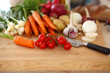 Fresh organic vegetables on a table with a knife for cooking