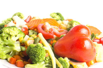 delicious vegetarian salad of boiled vegetables with a tomato