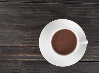 a cup of chocolate on wood table