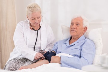 Nurse taking blood pressure