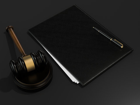 Wooden judges gavel and leather folder on black table