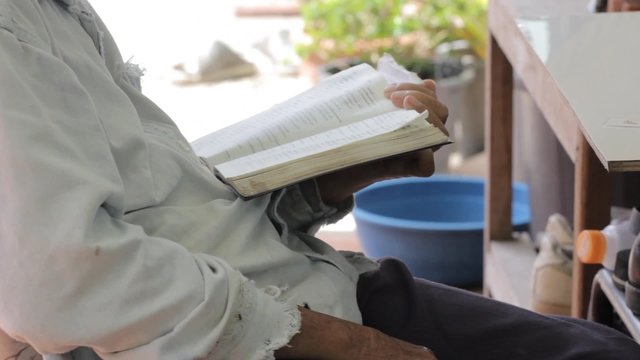 thai man reading the bible