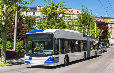 Fototapeta na wymiar Trolleybus on a street of Lausanne - Switzerland