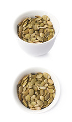 White cup filled with pumpkin seeds