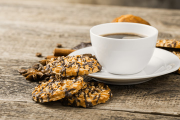 coffee and cookies on wood background