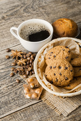 coffee and cookies on wood background